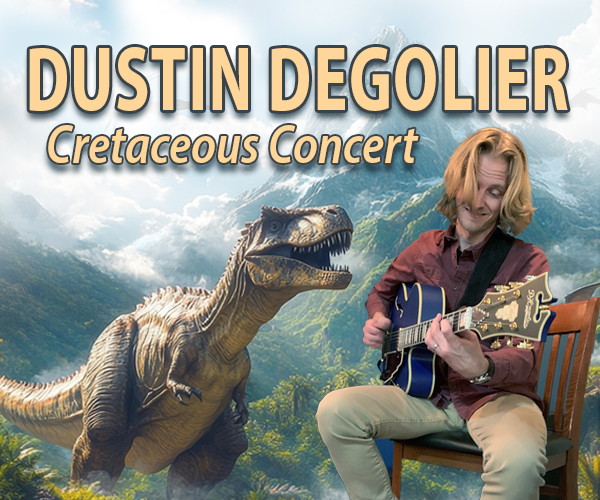Dustin DeGolier playing guitar in the jungle with a T Rex watching.