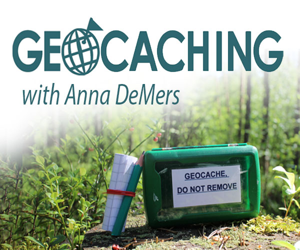 Geocaching with Anna DeMers and geocache in the woods